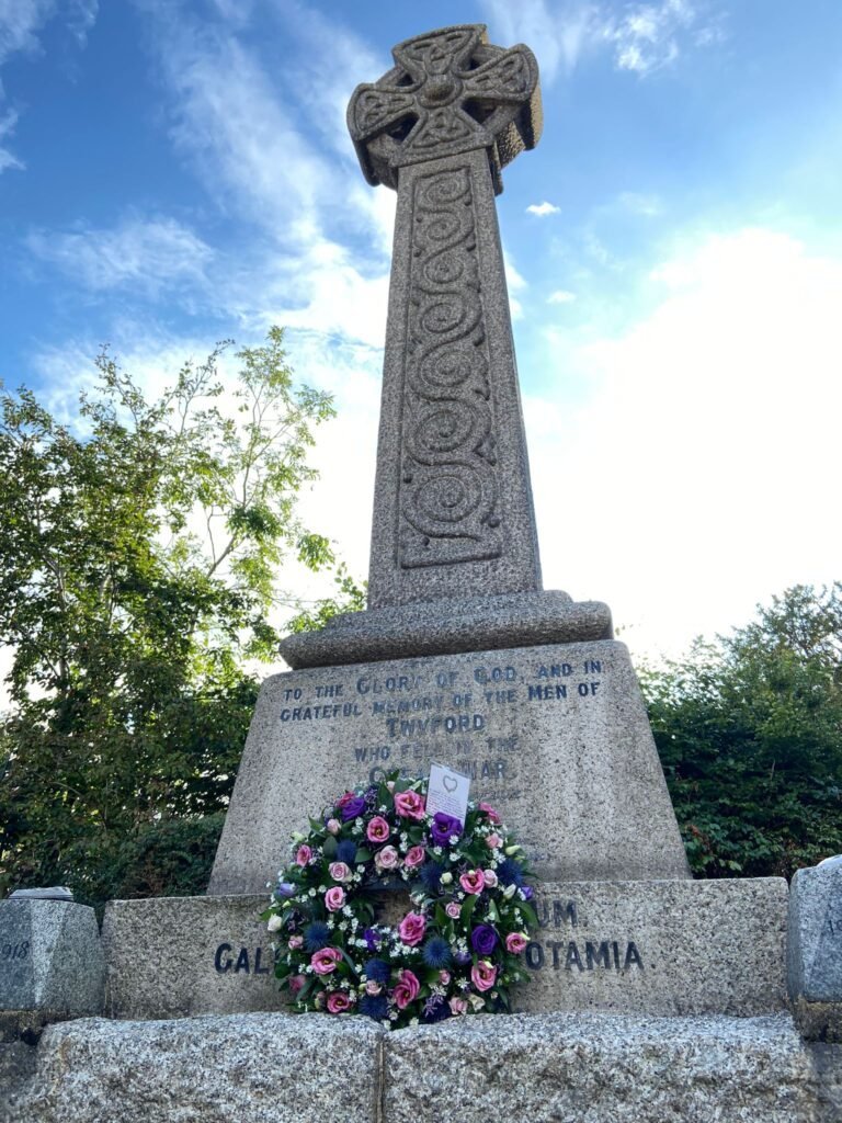 War memorial with wreath laid on